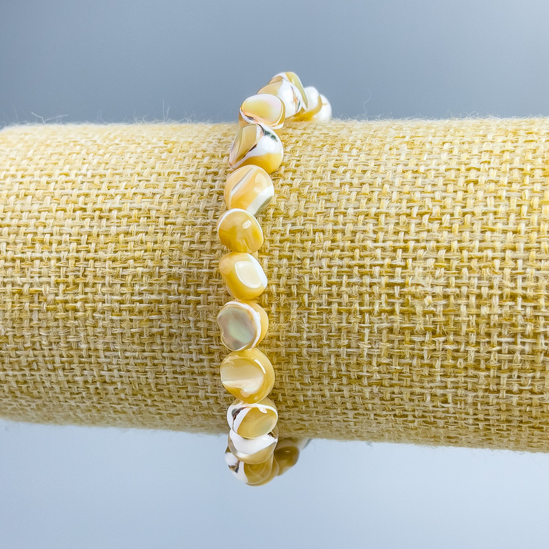 Armband aus beigem Perlmutt, facettierte Rondellen, Durchmesser 8 x 6 mm, Länge 18 cm (Elastik)