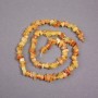 Bernstein-Chips auf Faden, Durchmesser 7 x 4 mm, Länge ca. 39 cm