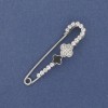 Shamrock Brooch Pin with White Rhinestones, 58 × 15 mm, silver-tone metal