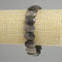 Bracelet with silvery obsidian, rounded faceted links, diameter 15×10 mm, 5–11 mm ±, 18 cm length, stretch