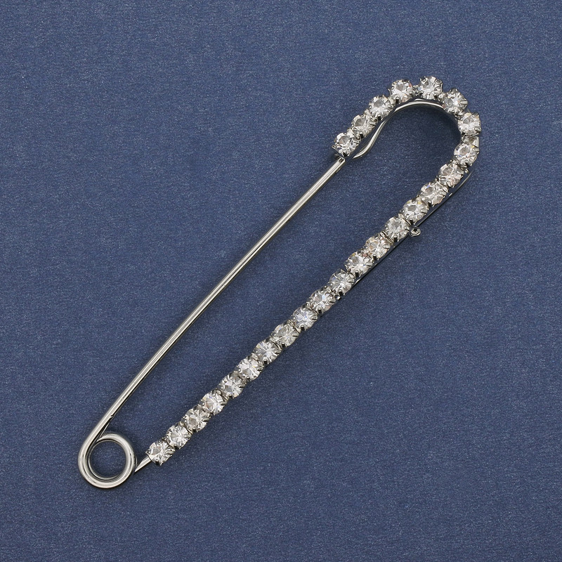 Silver-toned brooch pin with white rhinestones 72×16 mm