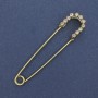 Brooch pin with white rhinestones, golden metal, 70×16 mm ±
