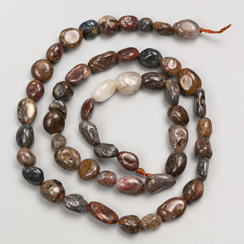 Petersite stone beads with texturing on thread, diameter 6x8 mm ±, length 40 cm ±