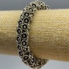 Women's bracelet with flowers, diameter 12 mm +-, length 18 cm (stretch) silver metal