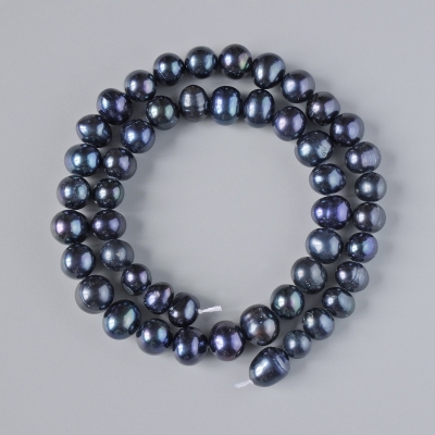 Намистини Чорні річкові перли, діаметр 8,5х7мм+-, довжина 35см+- на нитці