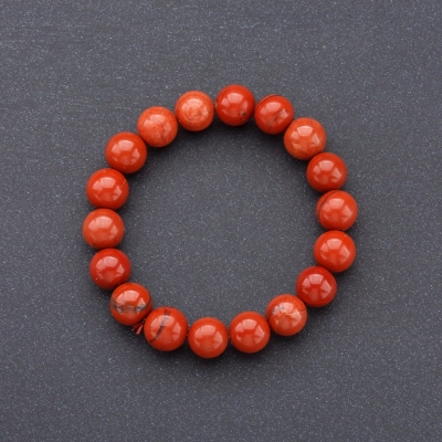 Браслет на резинці натуральний камінь Яшма червона гладка кулька, діаметр 10мм
