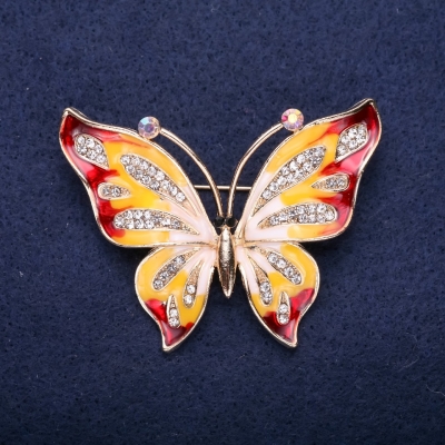 Брошка Метелик білі стрази червона, жовта емаль 42х56мм жовтий метал