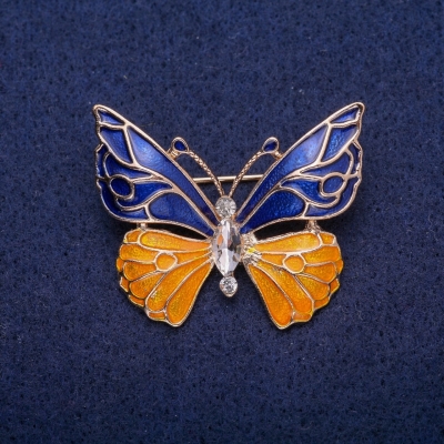 Брошка Метелик синьо-жовта емаль, білий кристал, золотистий метал 30х36мм