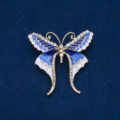 Брошка Метелик білі стрази, блакитна, синя і біла емаль, золотистий метал 48х50мм + -