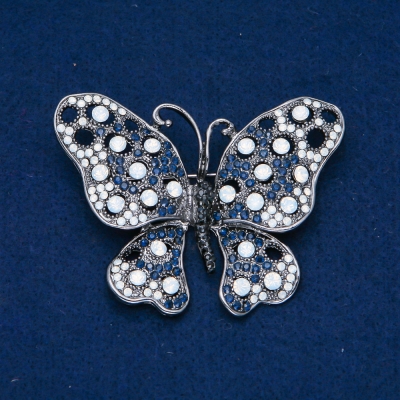Брошка Метелик т. Срібний метал, чорні, сині і білі стрази 50х66мм + -