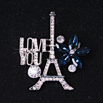Брошка Париж сріблястий метал стрази і сині кристали 40х35мм + -