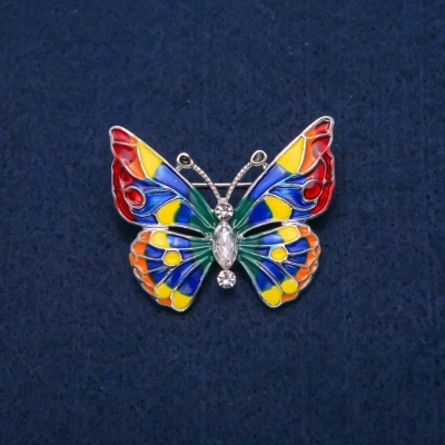 Брошка Метелик з білими кристалами і різнобарвною емаллю, золотистий метал 31х37мм