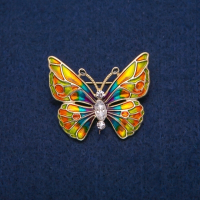 Брошка Метелик з білими кристалами і різнобарвною емаллю, золотистий метал 31х37мм