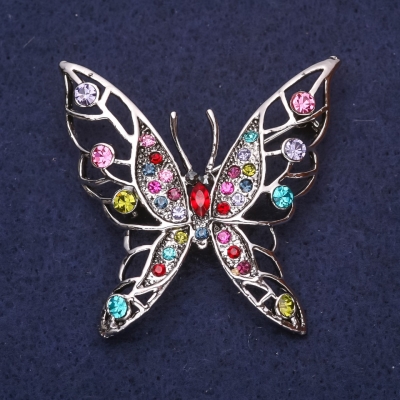 Брошка Метелик з рожевими блакитними зеленими стразами камінням 45х47мм сріблястий метал