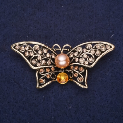 Брошка Метелик з жовтими каменями і перловою намистиною 55х25мм жовтий метал