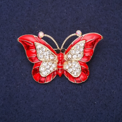 Брошка Метелик червона емаль білі стрази 45х28мм жовтий метал