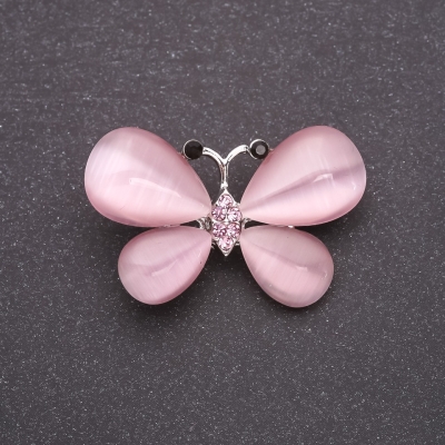 Брошка Метелик з натуральним каменем Котяче око рожевий 37х25мм сріблястий метал