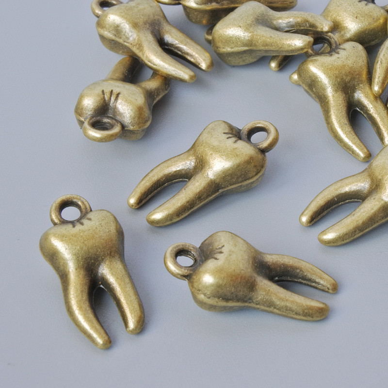 Pendant hardware "Tooth", diameter 15.5×7.5 mm, hole diameter 1.6 mm, batch 15± pieces, bronze metal color