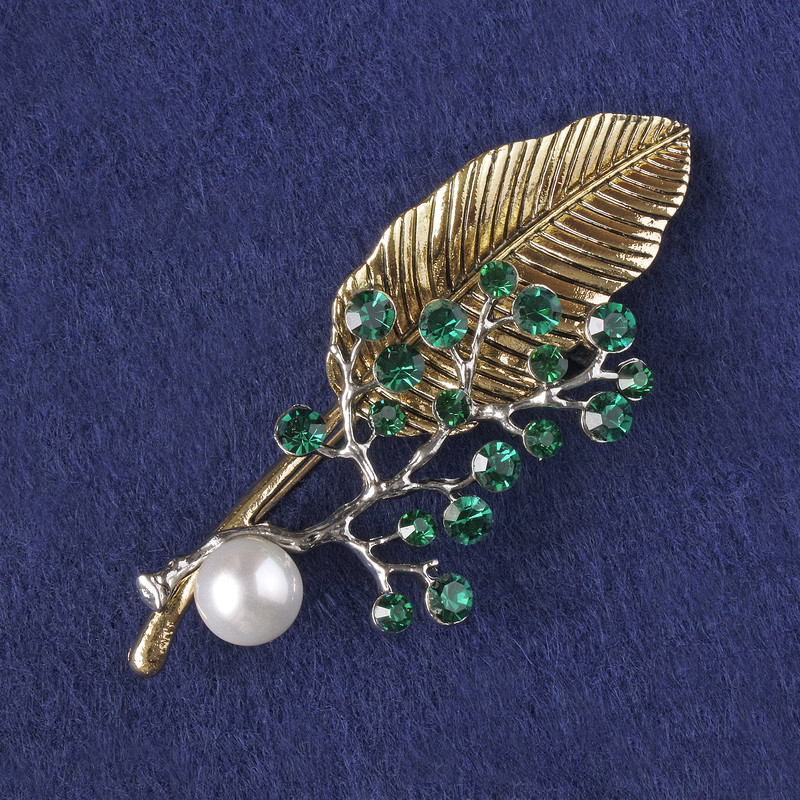 Brooch-pendant Sprig with green crystals, white bead, gold and silver metal 76x33mm+