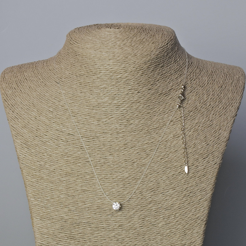 Pendant with White Crystal, diameter 6.5 mm ± on a nylon thread with clasp Xuping Rhodium, thickness 0.8 mm, length 45-50 cm+