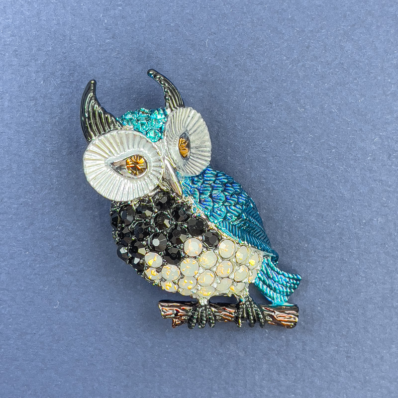 Brooch Pendant Owl with blue, black, rainbow rhinestones and enamel on silver metal, diameter 23mm+-, length 50mm+-