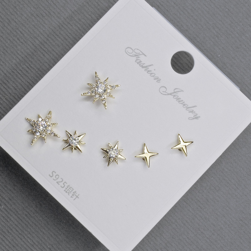 Posts Earrings 10-6mm± golden metal with white rhinestones
