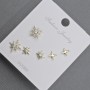 Posts Earrings 10-6mm± golden metal with white rhinestones