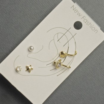 Earrings - studs and clips on the earlobe with golden metal, white rhinestones and a pearl