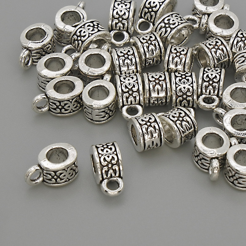 Bail, silver color, metal finish, size 6x5x10 mm ±, holes diameter 4 mm ± and 2 mm ±, packaging 20 g (~30 pcs)