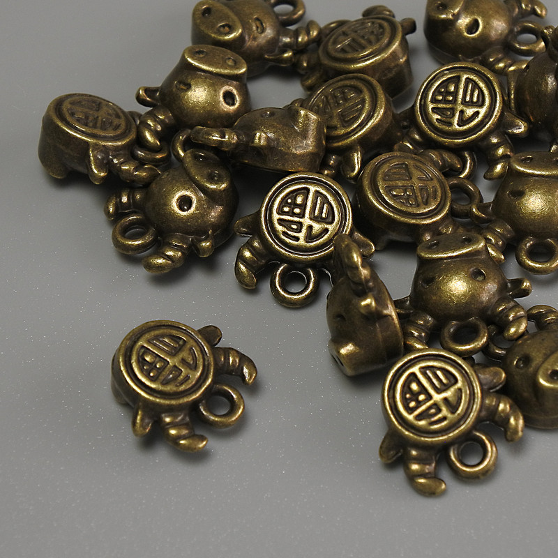 Bear pendant bronze color metal, size 10x9x5mm±, hole diameter 1mm±, packaging 20g (~17 pcs)
