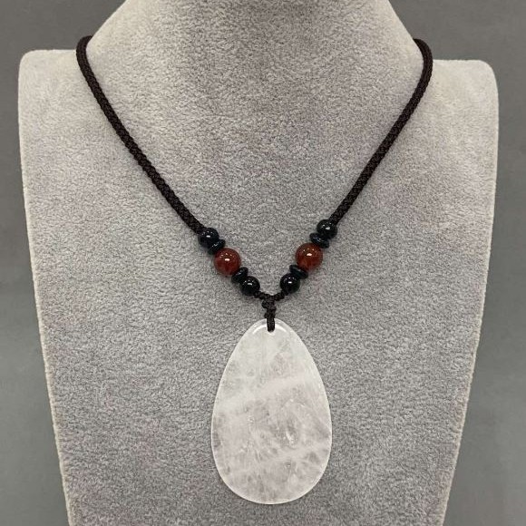 Pendant in the shape of a teardrop White Quartz 55x35mm (+-) on a cord with carnelian beads, length 65cm+