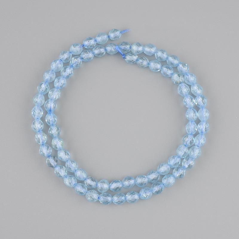 Topaz beads faceted grain, diameter 5-5.5 mm, 5x5 mm ±, length 39 cm ± on a thread