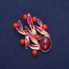 Brooch Leaves with Carnelian, burgundy enamel, golden metal 38x53mm