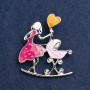 Brooch 'Mother with a Cradle' with enamel in pink and raspberry on silver metal 46x38mm