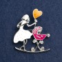 Brooch 'Mother with Cradle' with white and raspberry enamel, silver-toned metal 46x38mm