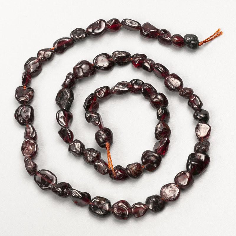 Garnet Beads natural stone ribbed, diameter 8x7mm+-, length 41cm+- on a thread