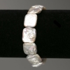 Bracelet with Baroque Pearls, rectangular shape, color tone “gasoline”, diameter 14x16mm±, length 18cm± (elastic)