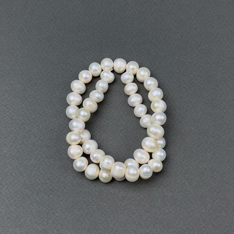 Freshwater oval pearls on a thread, 10x8 mm diameter, length 38 cm
