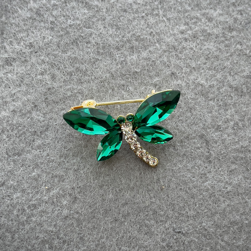 Brooch 'Butterfly' with green and white crystals on golden metal 20x28 mm