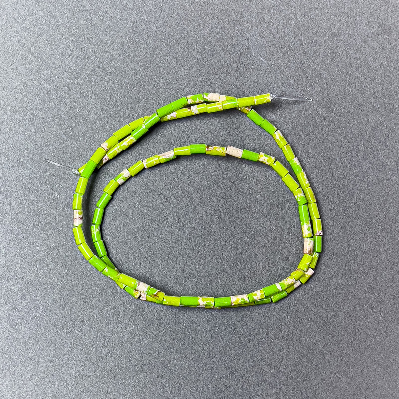 Variscite Beads, light green (pressed) faceted, 2×4 mm, 38 cm on monofilament