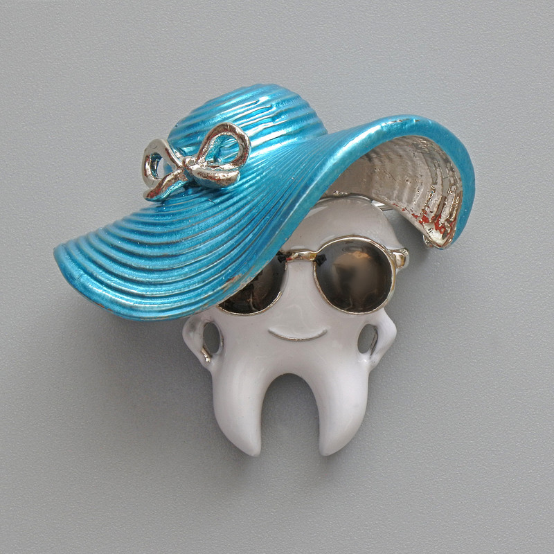 Brooch "Tooth in a Hat" with enamel in blue and black, silver metal 33x30mm