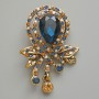Brooch Pendant Accent with Blue Crystal, blue, white and yellow rhinestones, golden metal 37x46mm